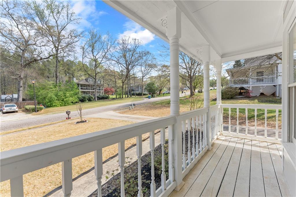 322 Wyngate Road Auburn, GA 30011 - Photo 9 of 44 a view of a balcony with wooden floor and fence