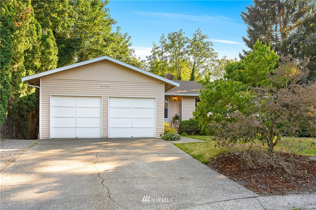 924 217th Street Southwest Bothell, WA 98021 - Photo 2 of 30 a front view of a house with a garage
