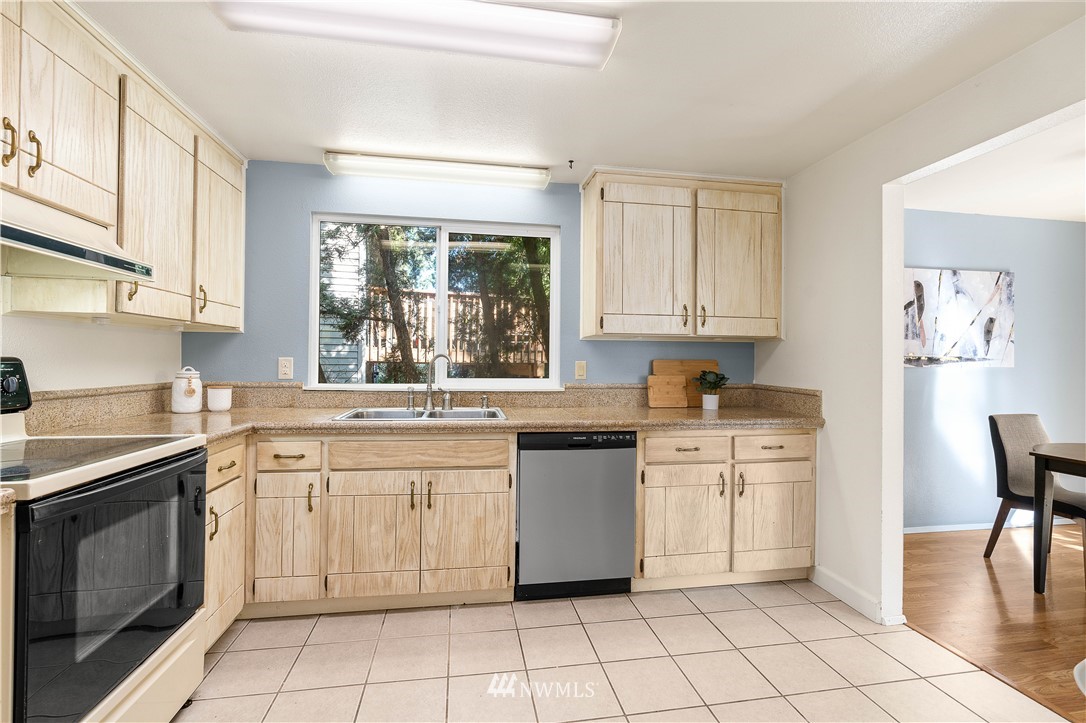 924 217th Street Southwest Bothell, WA 98021 - Photo 11 of 30 a kitchen with a stove sink and cabinets