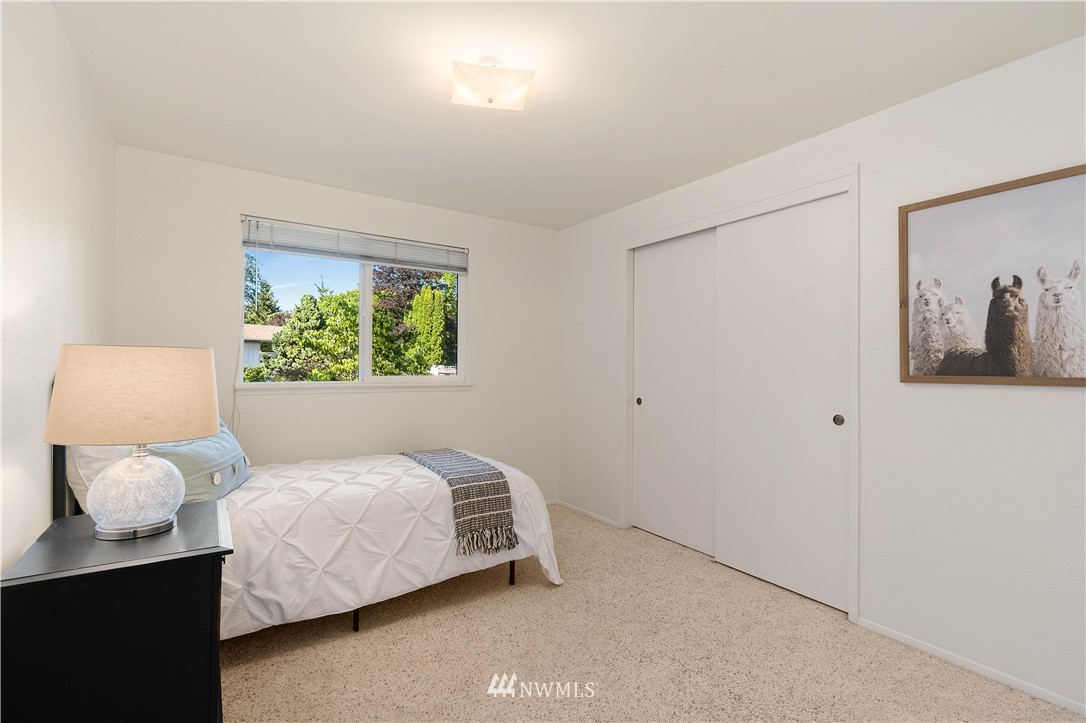 924 217th Street Southwest Bothell, WA 98021 - Photo 14 of 30 a bedroom with a bed and a painting on the wall