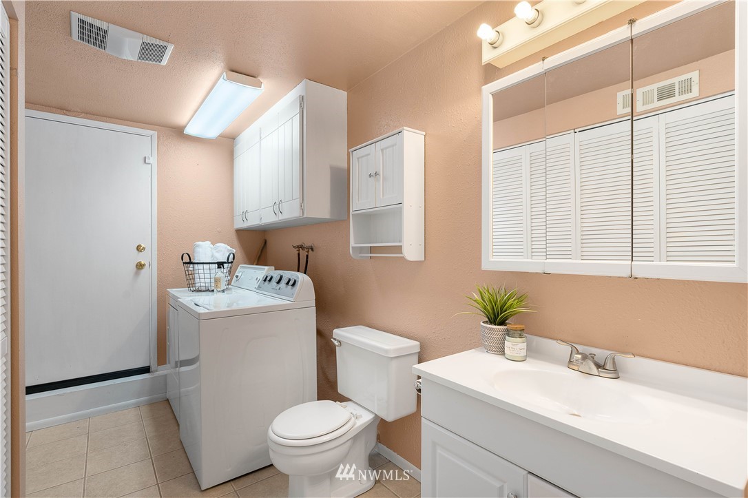 924 217th Street Southwest Bothell, WA 98021 - Photo 21 of 30 a bathroom with a sink toilet and window