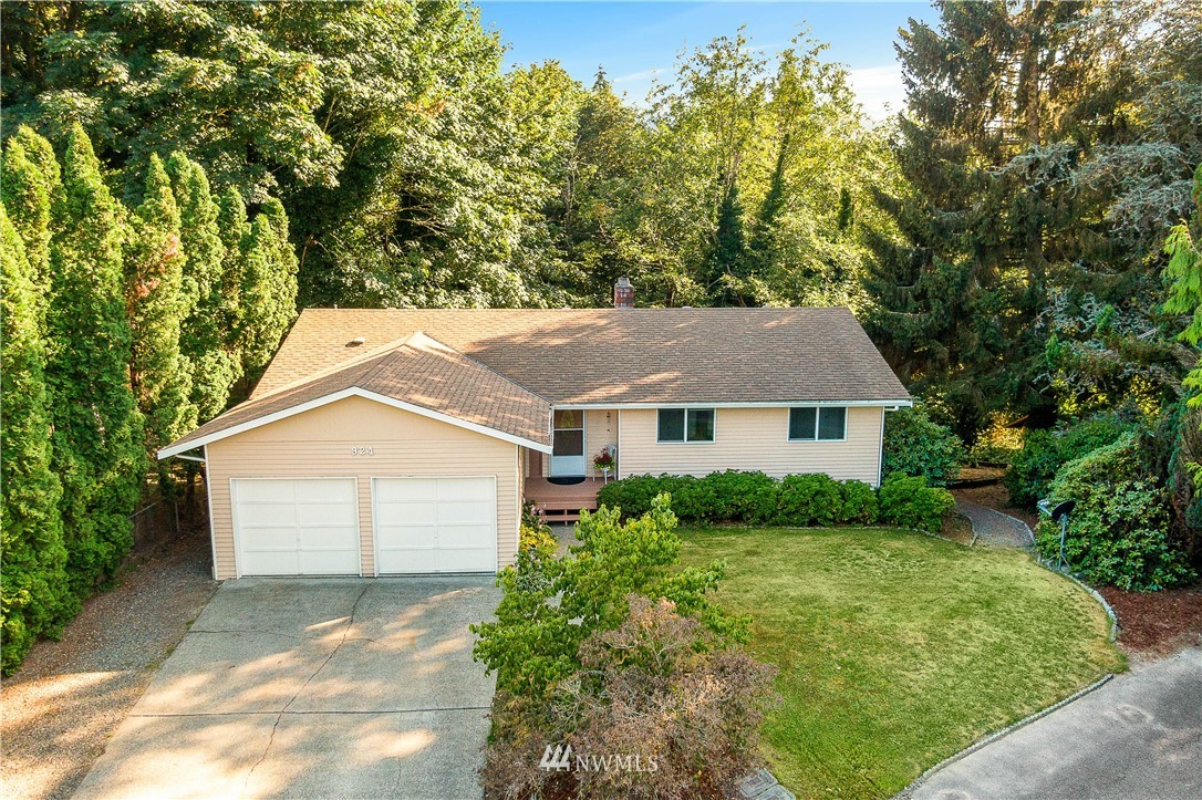 924 217th Street Southwest Bothell, WA 98021 - Photo 25 of 30 a front view of a house with a yard and garage