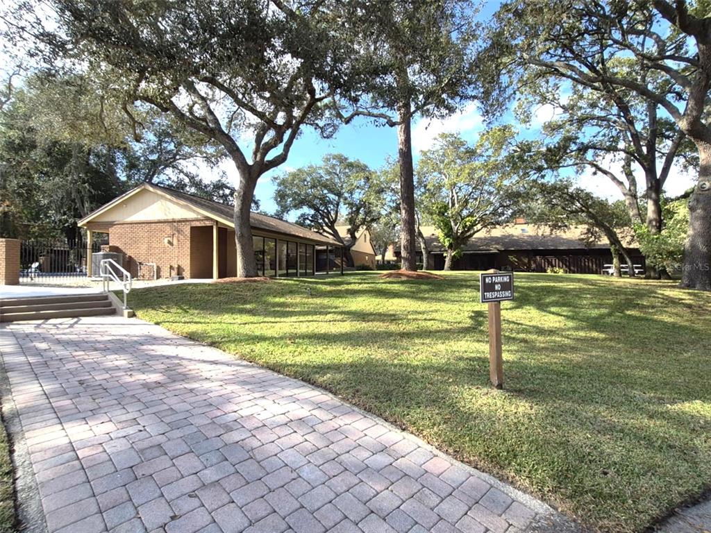 111 Feather Edge Loop, Unit 4B Lake Mary, FL 32746 - Photo 24 of 27 a view of a house with a backyard