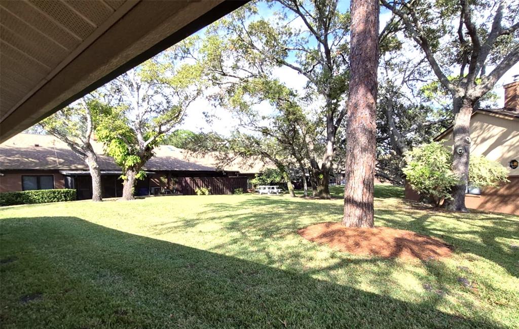 111 Feather Edge Loop, Unit 4B Lake Mary, FL 32746 - Photo 25 of 27 a house with trees in front of it