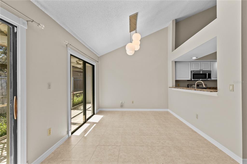 111 Feather Edge Loop, Unit 4B Lake Mary, FL 32746 - Photo 6 of 27 an empty room with windows and fan