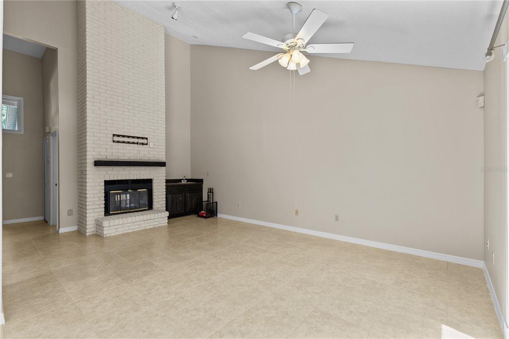 111 Feather Edge Loop, Unit 4B Lake Mary, FL 32746 - Photo 7 of 27 an empty room with a fireplace