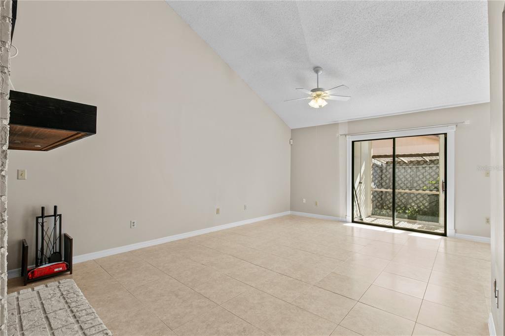 111 Feather Edge Loop, Unit 4B Lake Mary, FL 32746 - Photo 9 of 27 an empty room with windows and fan