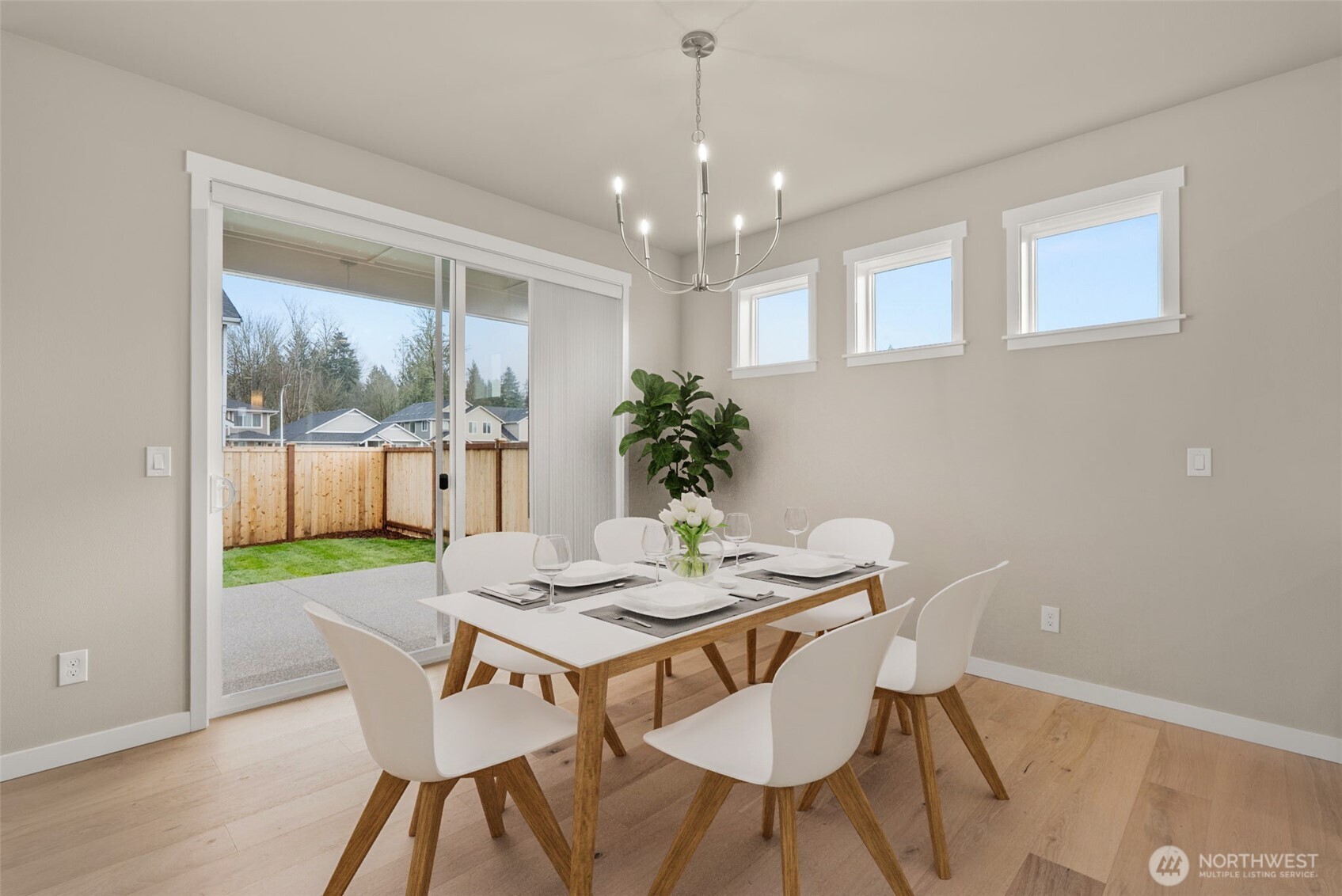 7308 Jenner Street Southwest Tumwater, WA 98512 - Photo 12 of 40 a view of a dining room with furniture window and wooden floor