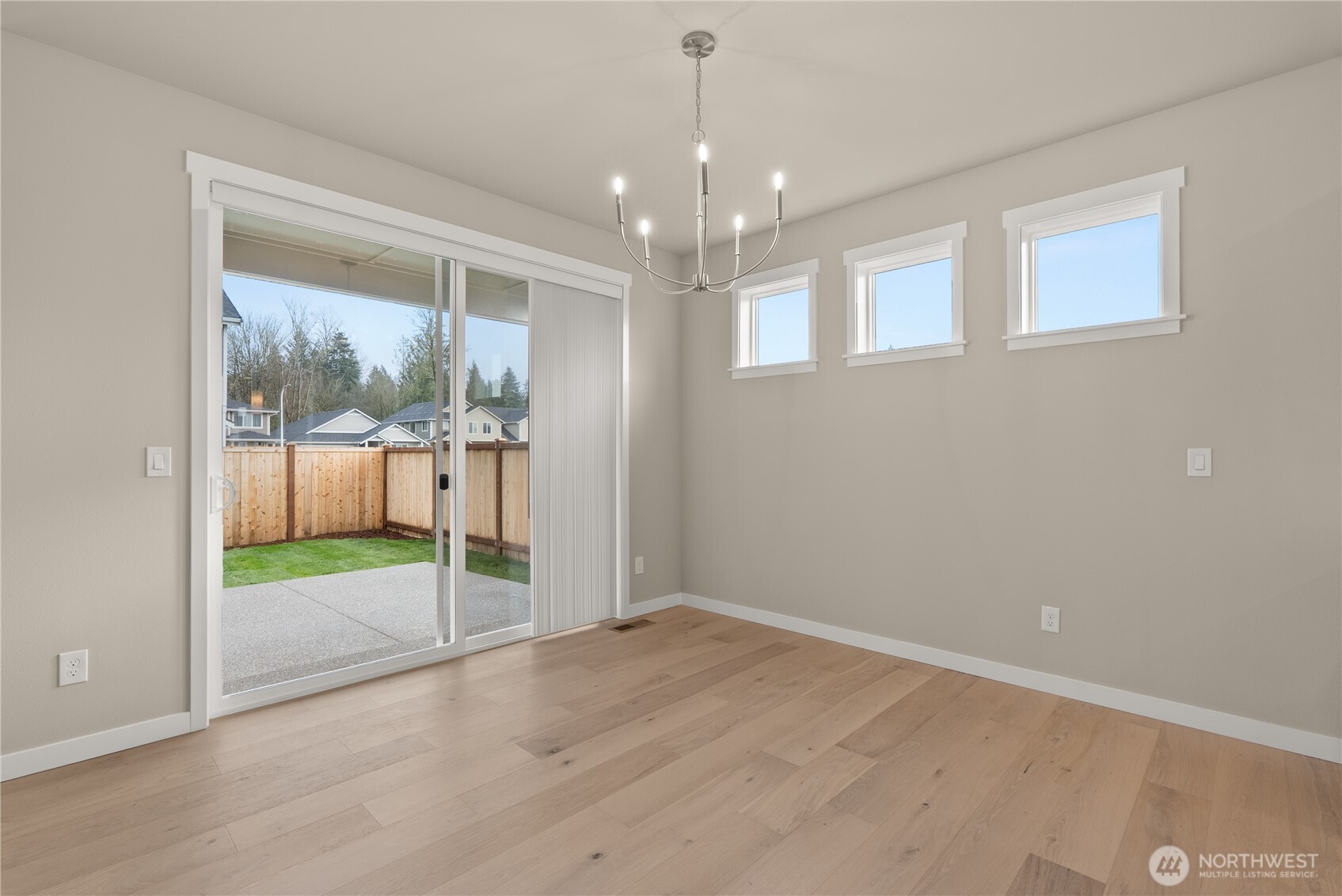 7308 Jenner Street Southwest Tumwater, WA 98512 - Photo 14 of 34 en empty room with sliding door and front door