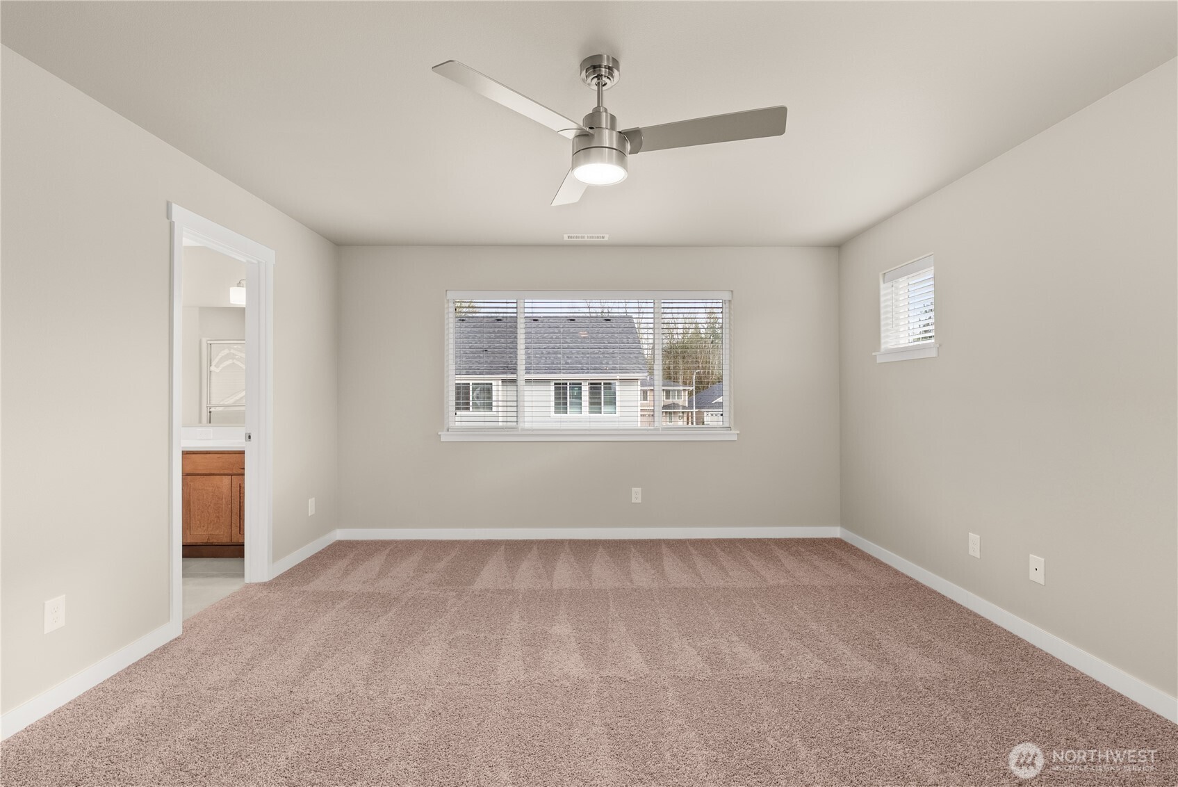 7308 Jenner Street Southwest Tumwater, WA 98512 - Photo 17 of 34 wooden floor in an empty room with a window
