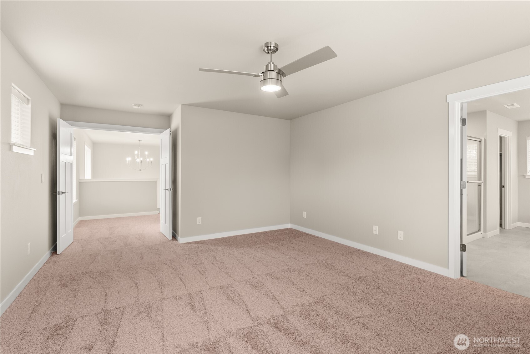7308 Jenner Street Southwest Tumwater, WA 98512 - Photo 18 of 34 a view of an empty room with a ceiling fan