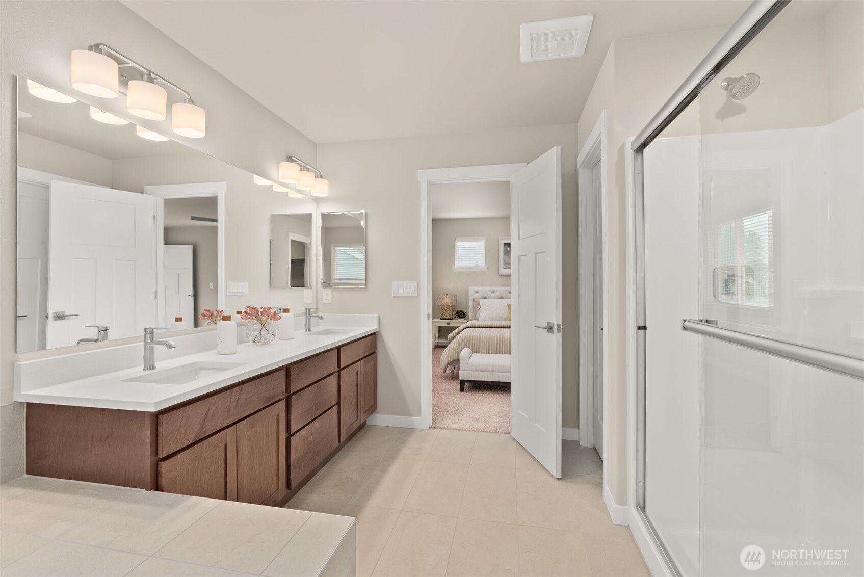 7308 Jenner Street Southwest Tumwater, WA 98512 - Photo 19 of 40 a spacious bathroom with a double vanity sink mirror and