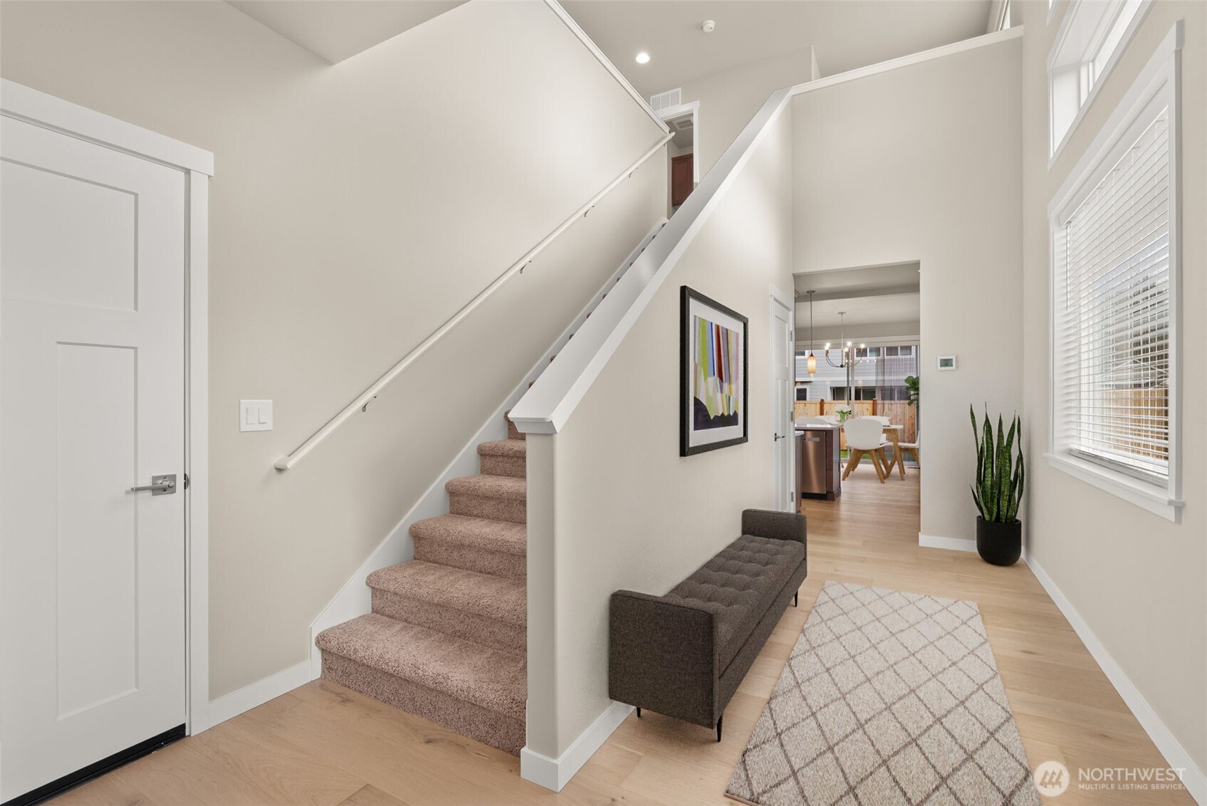 7308 Jenner Street Southwest Tumwater, WA 98512 - Photo 2 of 40 a view of entryway and hall with wooden floor
