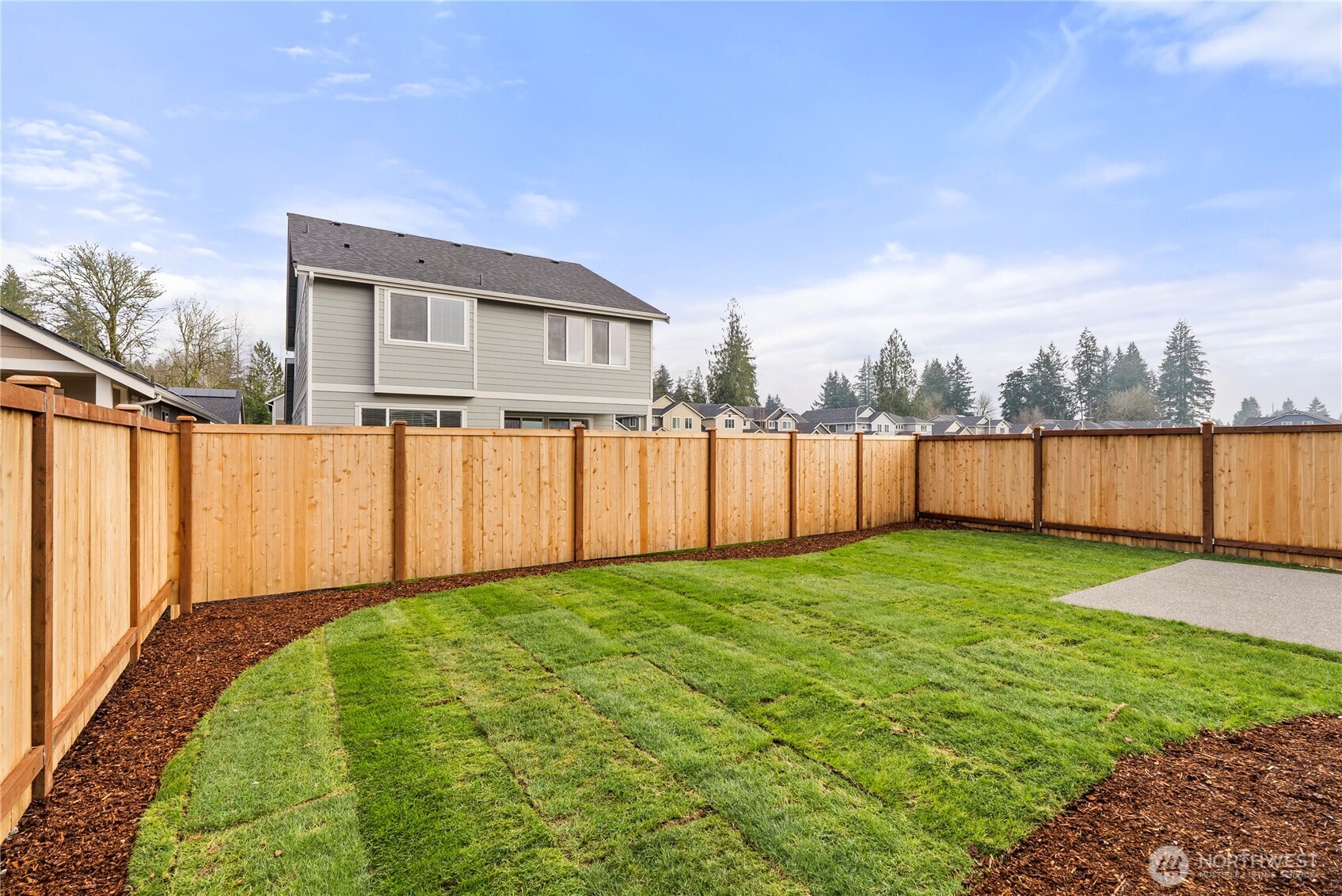 7308 Jenner Street Southwest Tumwater, WA 98512 - Photo 30 of 34 a view of a backyard with a garden