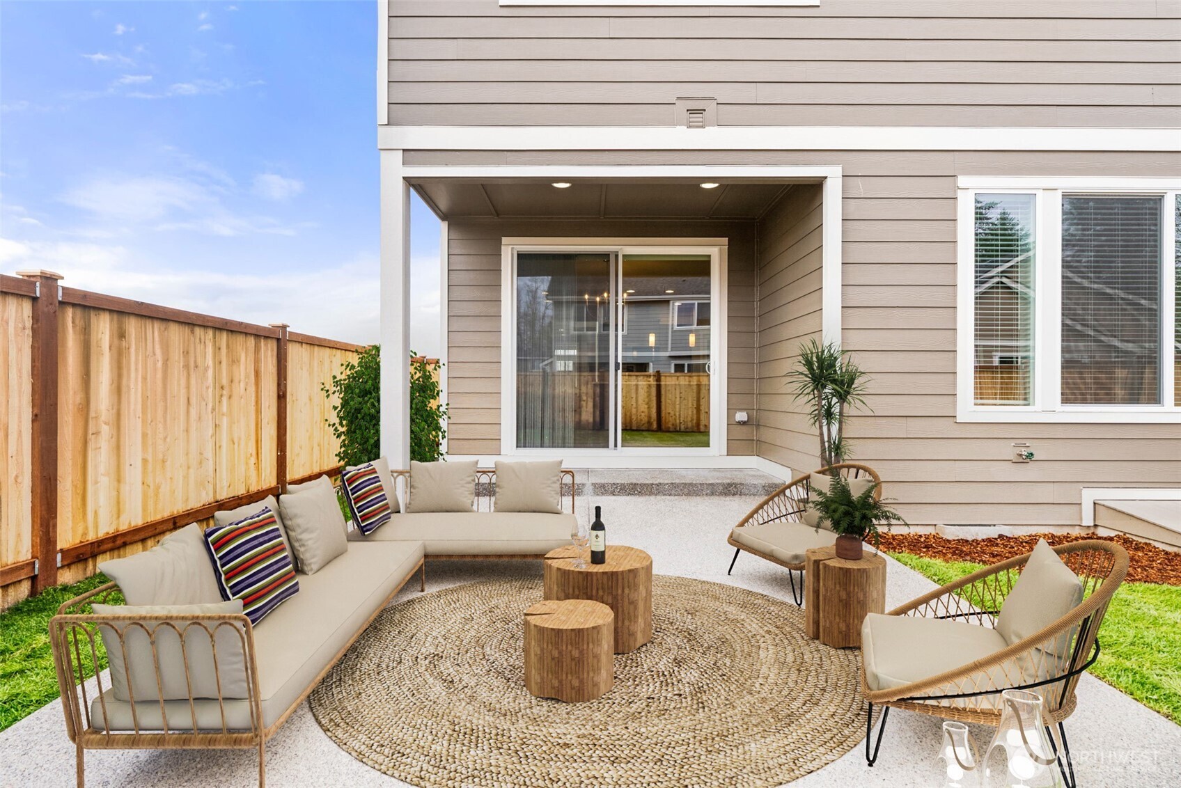 7308 Jenner Street Southwest Tumwater, WA 98512 - Photo 31 of 40 a view of a patio with couches table and chairs and potted plants