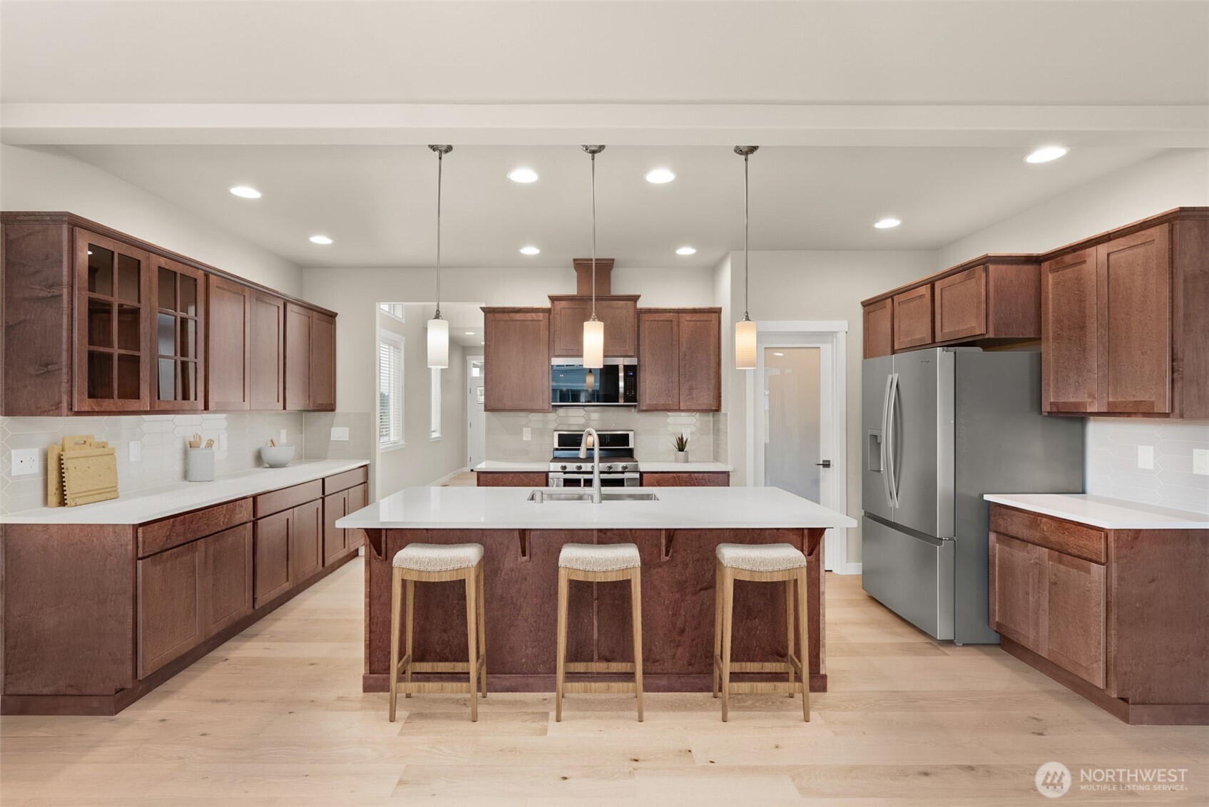 7308 Jenner Street Southwest Tumwater, WA 98512 - Photo 6 of 40 a large kitchen with cabinets and stainless steel appliances