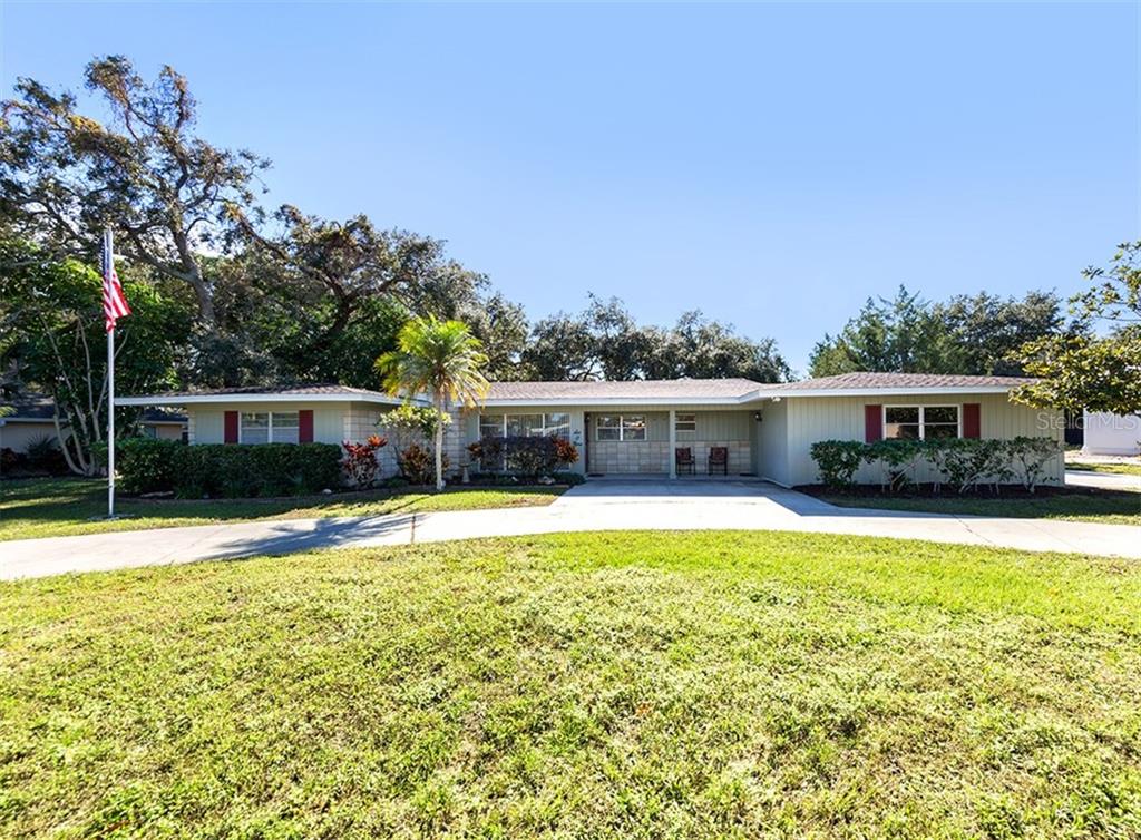609 Cadiz Road Venice, FL 34285 - Photo 1 of 1 609 Cadiz Road - Ocala block home in a mid century modern design on almost .40 acres.