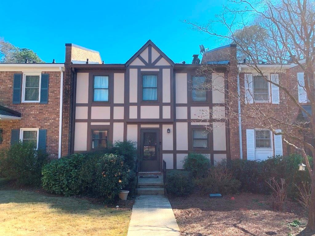 2948 Lavista Way Decatur, GA 30033 - Photo 1 of 1 a front view of a residential apartment building with a yard