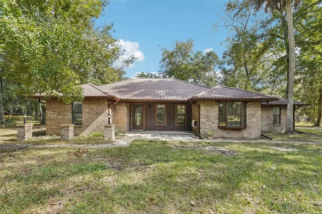 a front view of a house with yard