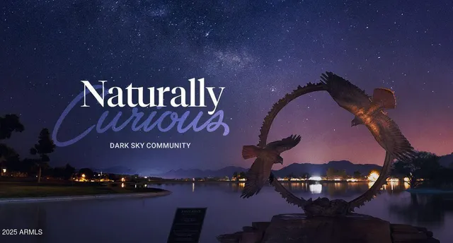 a view of a swimming pool with outdoor seating