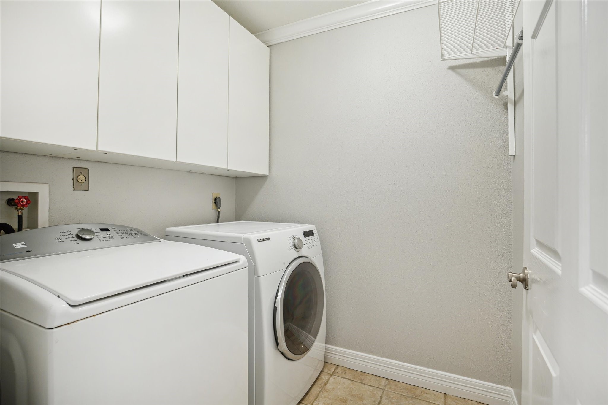 6310 Arnot Street Houston, TX 77007 - Photo 14 of 21 Nice upstairs laundry room with storage space.