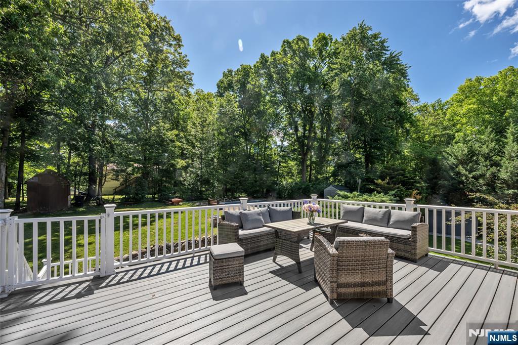 21 Marcia Road Ringwood, NJ 07456 - Photo 32 of 42 a view of a deck with furniture and trees