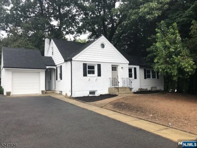 a kitchen with a sink stove and microwave