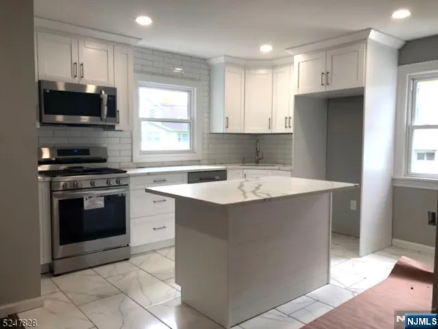 a house view with a backyard space