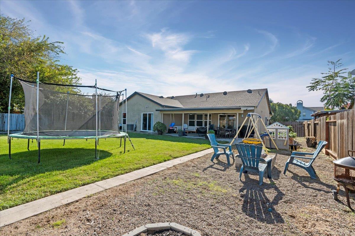 1725 Stonum Road Modesto, CA 95351 - Photo 29 of 34 a view of a house with backyard and sitting area