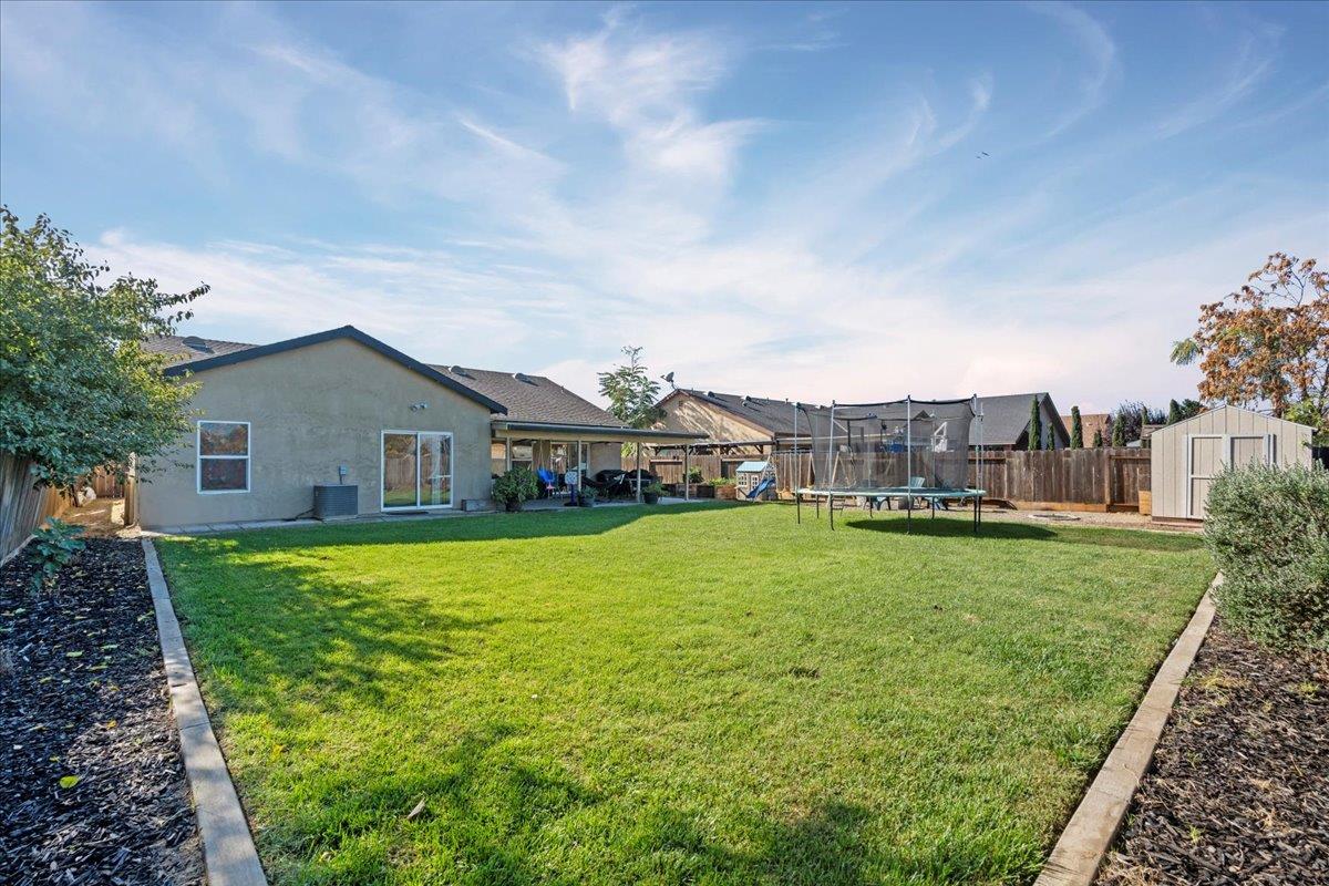 1725 Stonum Road Modesto, CA 95351 - Photo 31 of 34 a house view with a garden space