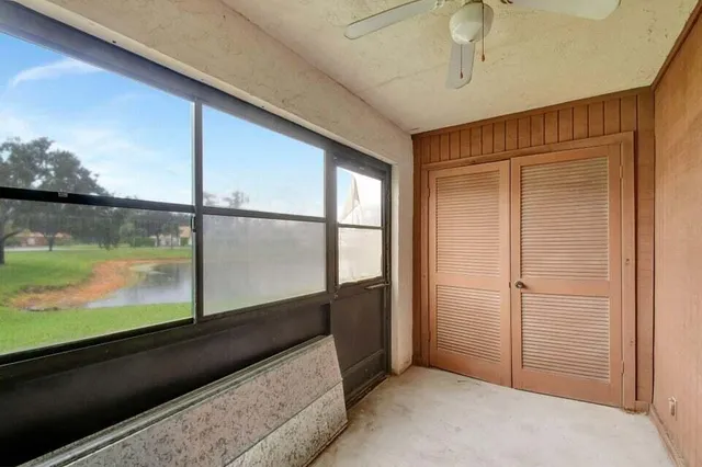 a view of a swimming pool with a back yard