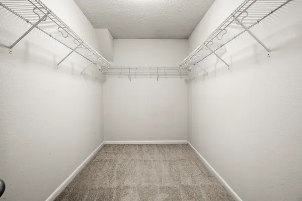 a view of a room with racks on the wall