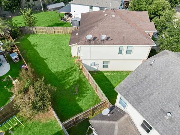 an aerial view of a house with a garden