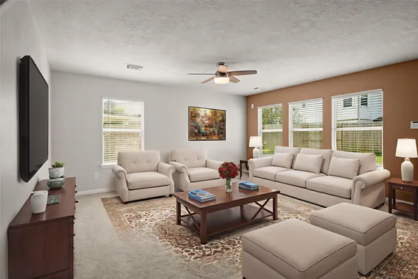 a living room with furniture a large window and a flat screen tv