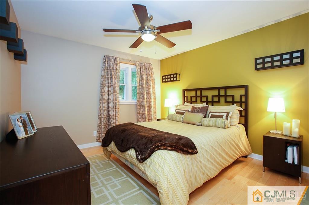 24 Halstead Road New Brunswick, NJ 08901 - Photo 11 of 23 a bedroom with a bed and a tv