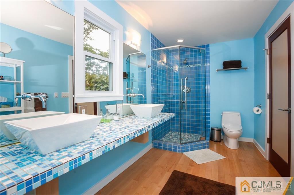 24 Halstead Road New Brunswick, NJ 08901 - Photo 13 of 23 a bedroom with a bed and a view of bathroom