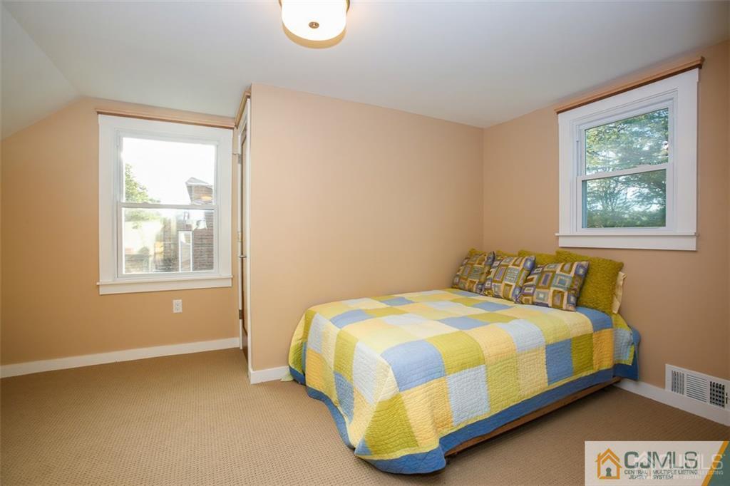 24 Halstead Road New Brunswick, NJ 08901 - Photo 16 of 23 a bedroom with a bed and window