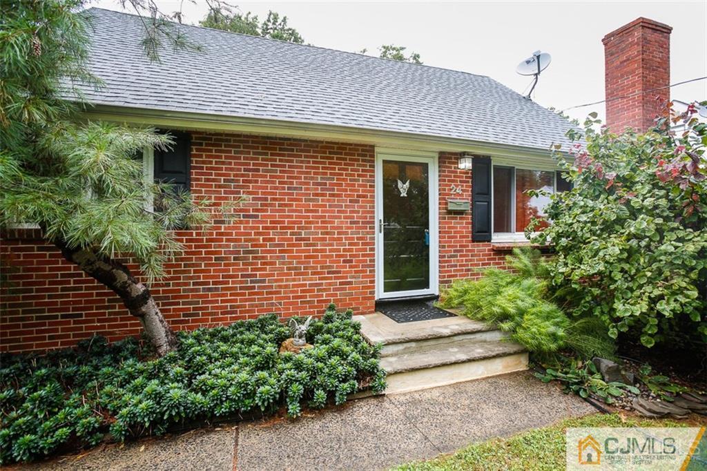 24 Halstead Road New Brunswick, NJ 08901 - Photo 2 of 23 a front view of a house with a garden