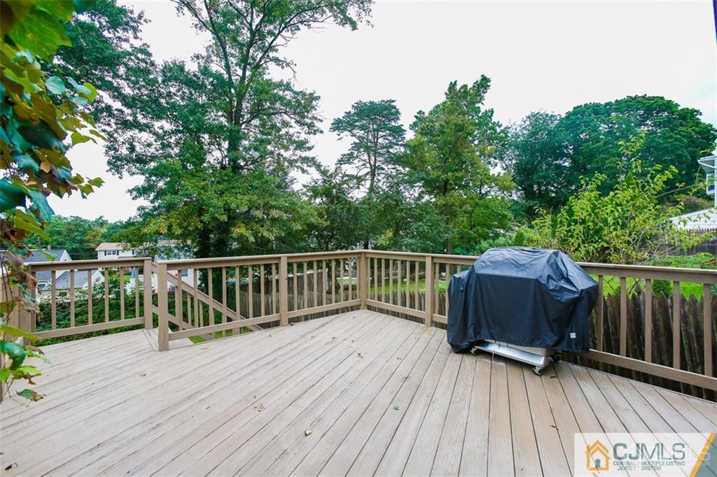 24 Halstead Road New Brunswick, NJ 08901 - Photo 21 of 23 a view of deck with wooden floor and outdoor seating