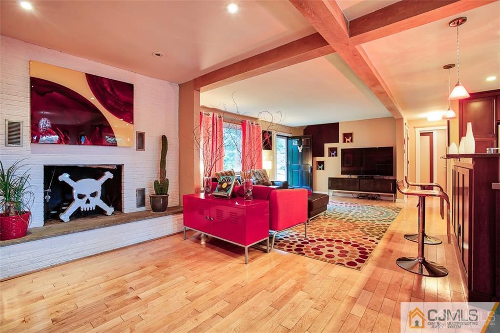24 Halstead Road New Brunswick, NJ 08901 - Photo 5 of 23 a living room with furniture fireplace and flat screen tv
