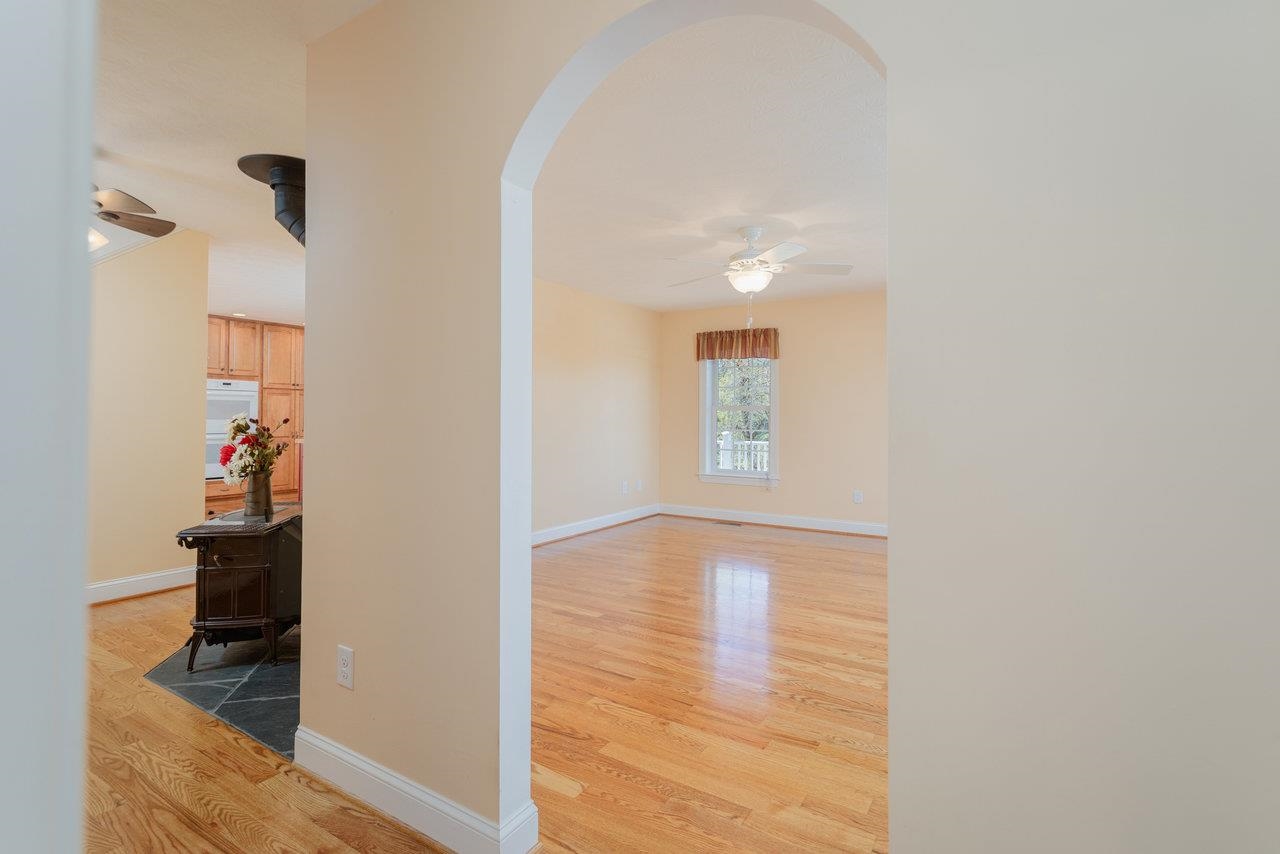 82 Smoky Row Road Staunton, VA 24401 - Photo 17 of 75 a view of empty room with wooden floor and fan
