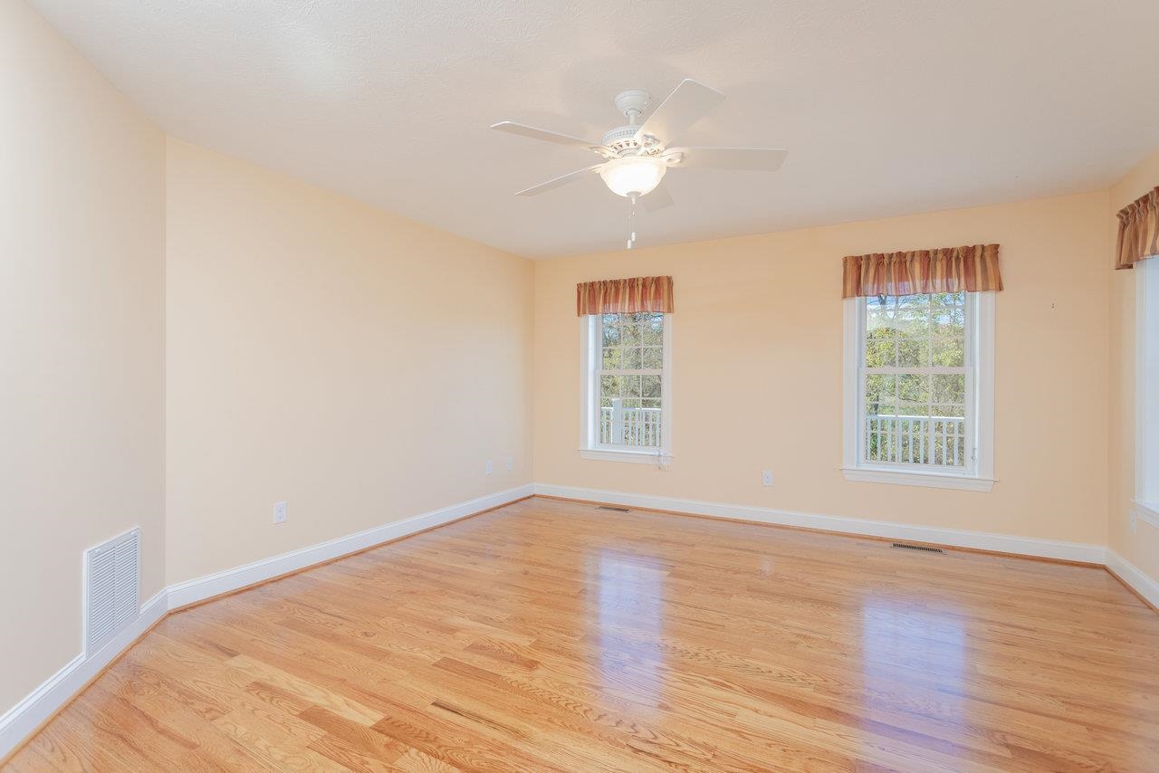 82 Smoky Row Road Staunton, VA 24401 - Photo 19 of 75 a view of an empty room with wooden floor and a window