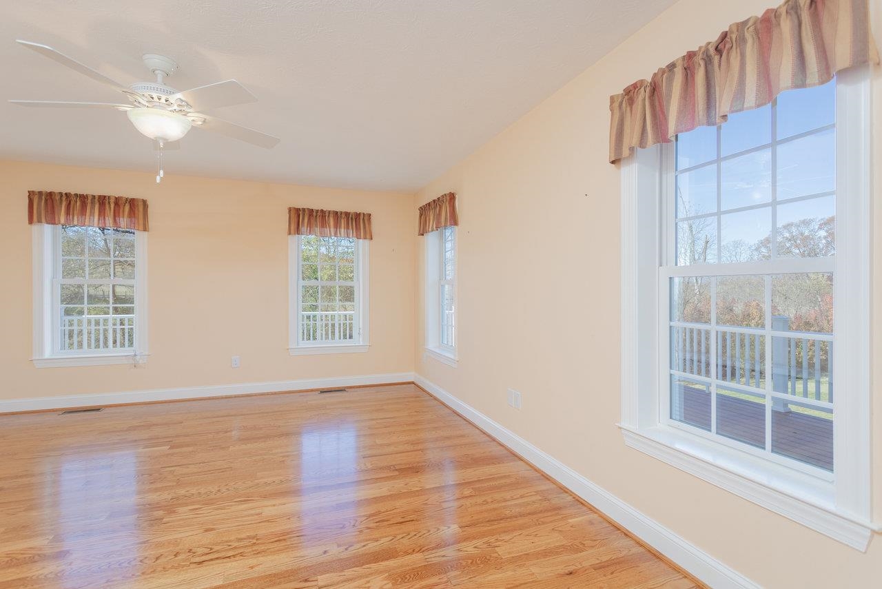 82 Smoky Row Road Staunton, VA 24401 - Photo 21 of 75 a view of an empty room with wooden floor and a window