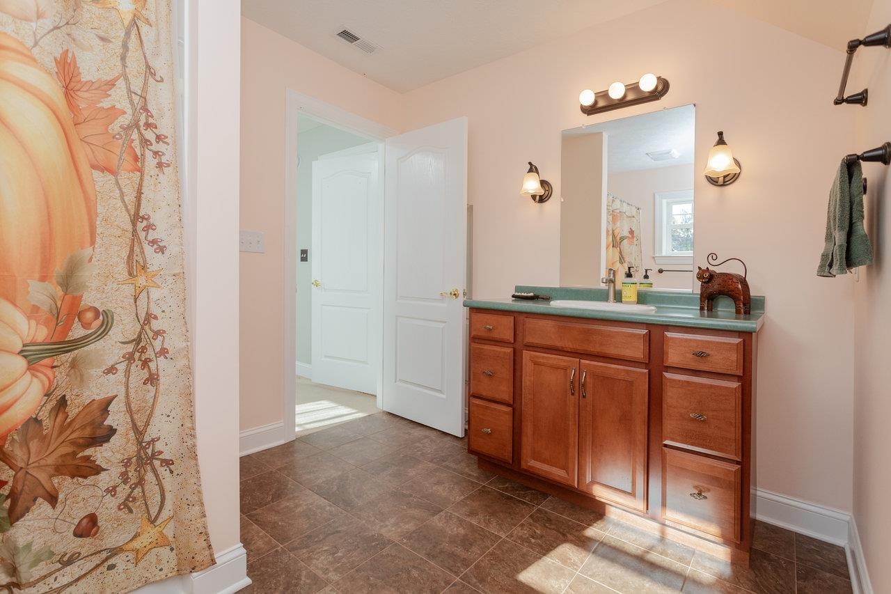 82 Smoky Row Road Staunton, VA 24401 - Photo 29 of 75 a spacious bathroom with a double vanity sink and a mirror