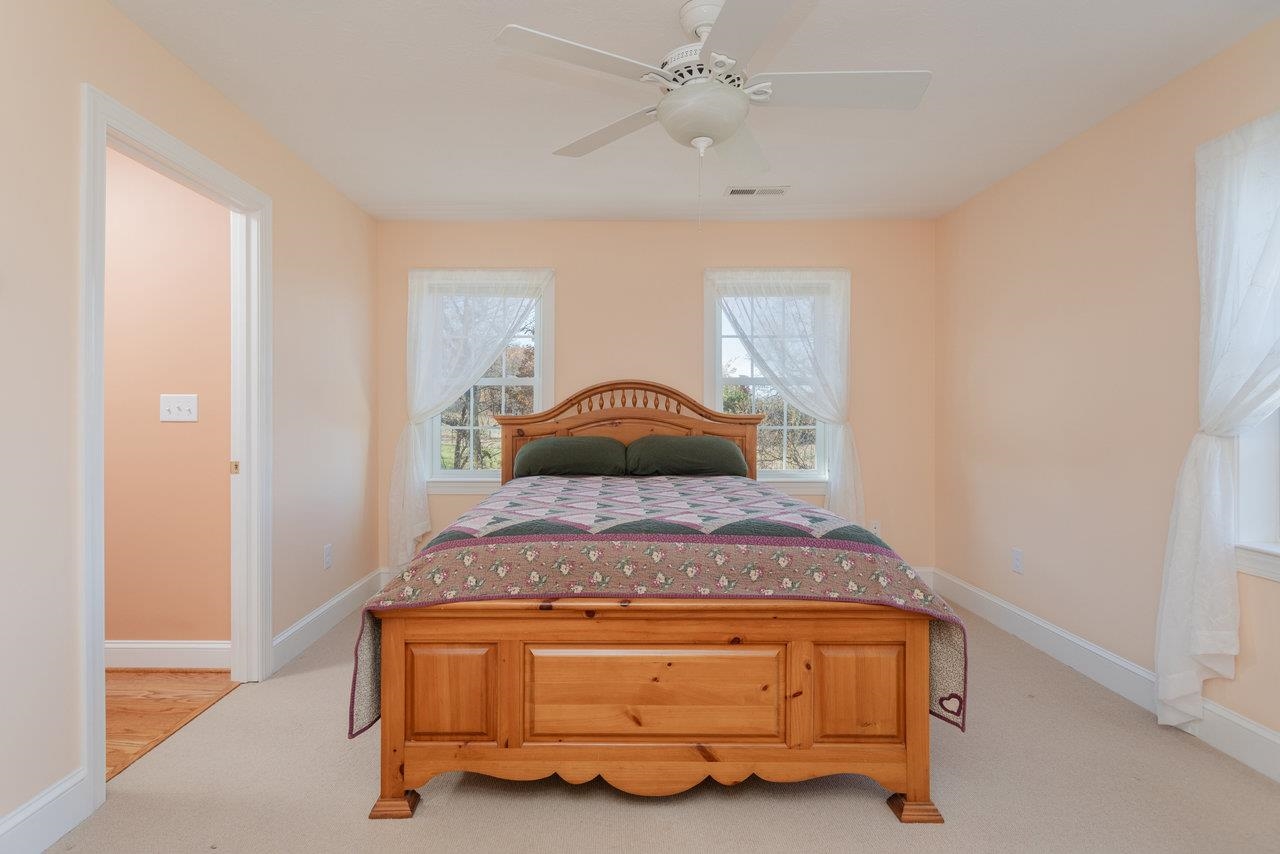 82 Smoky Row Road Staunton, VA 24401 - Photo 31 of 75 a room with a bed and a chandelier