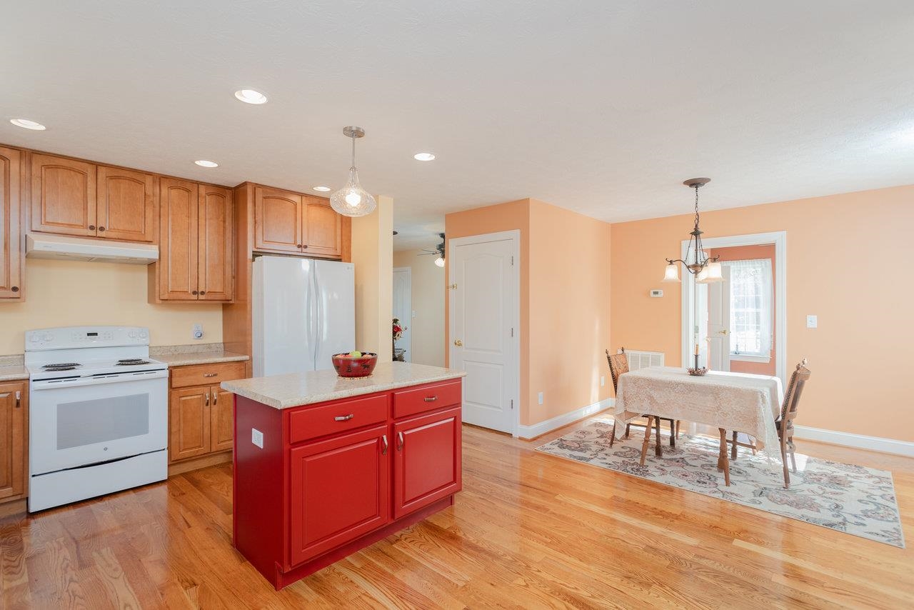 82 Smoky Row Road Staunton, VA 24401 - Photo 4 of 75 a kitchen with stainless steel appliances granite countertop a refrigerator a sink dishwasher a dining table and chairs with wooden floor