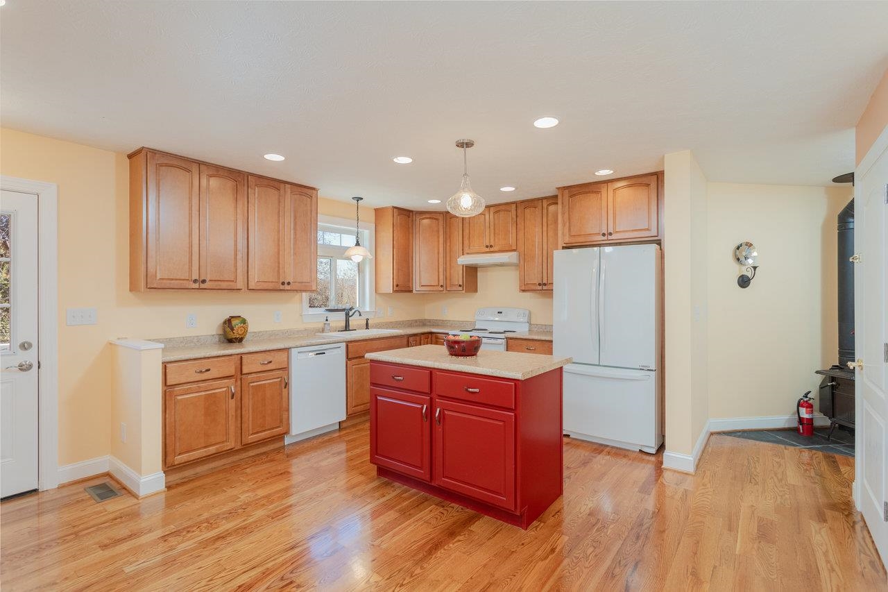 82 Smoky Row Road Staunton, VA 24401 - Photo 6 of 75 a kitchen with kitchen island wooden floors appliances and cabinets
