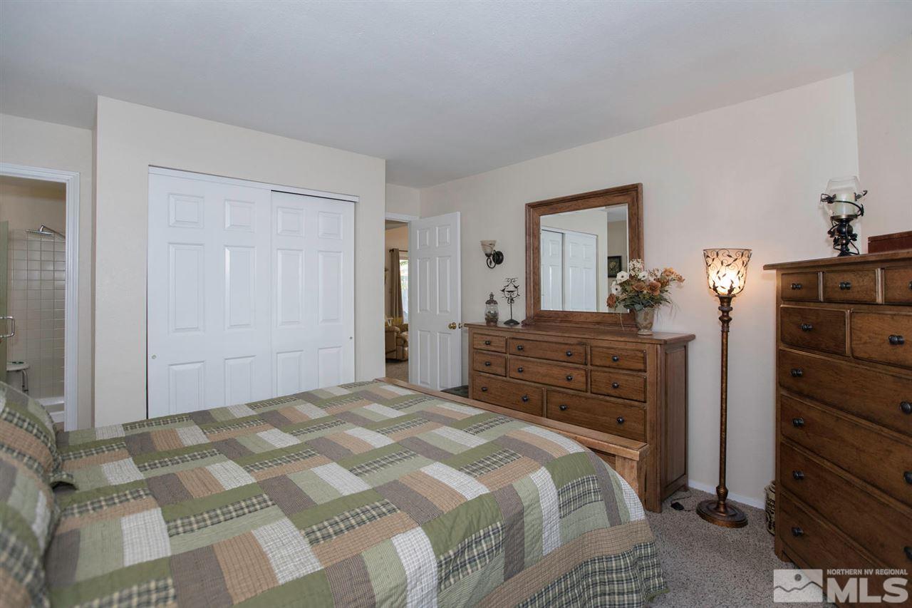 2264 Escalera Way Reno, NV 89523 - Photo 13 of 25 a bedroom with a bed and a dresser