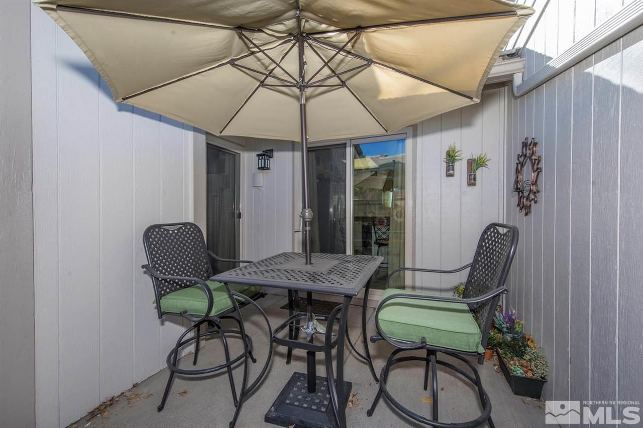 2264 Escalera Way Reno, NV 89523 - Photo 19 of 25 a patio table and chairs under an umbrella