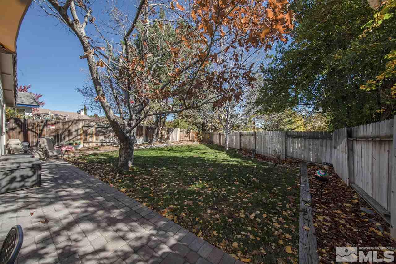 2264 Escalera Way Reno, NV 89523 - Photo 22 of 25 a view of a backyard with large trees